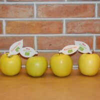 Gelb-grüner Bio-Apfel mit individuellem Werbeblatt