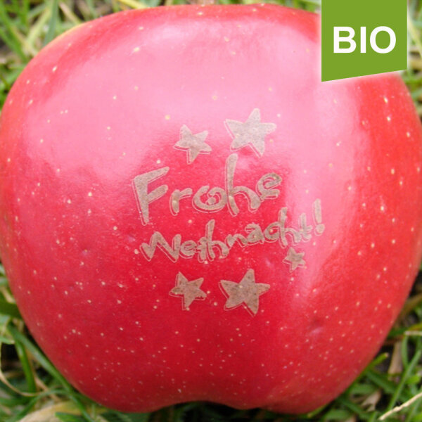 Roter Bio-Apfel mit Frohe Weihnacht Laserbranding